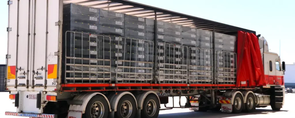 Truck carrying Coles' smart bins that are used to digitalise their supply chain