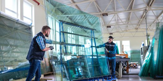 Two people holding a glass that will use a smart glass rack tracking solution