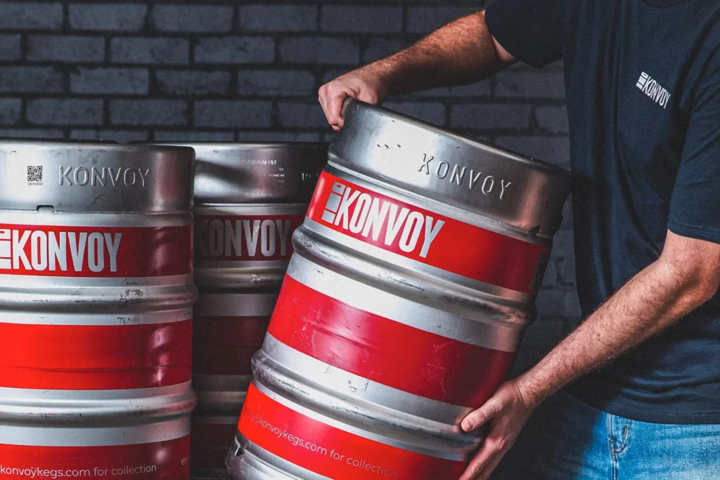 Person carrying a keg that uses beer keg tracking technology