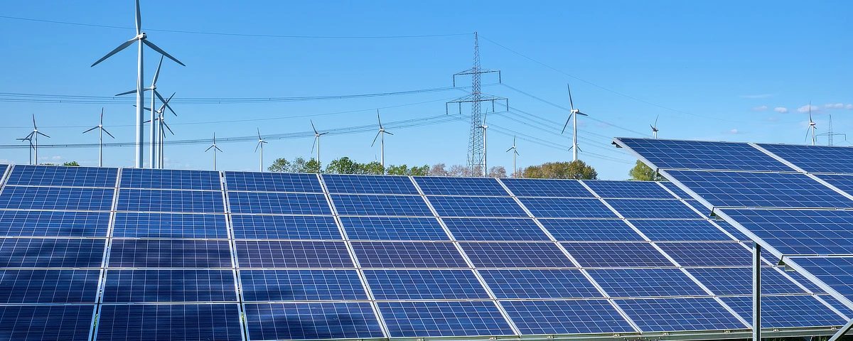 Solar panels and wind turbines that use technology to improve energy efficiency for businesses