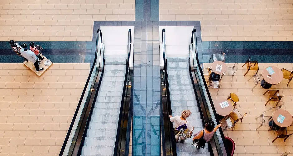 People walking in a retail precinct that uses payment terminal SIM cards