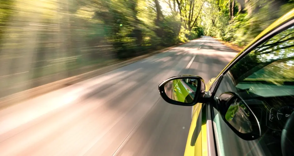 Car driving on a road using a stolen vehicle recovery system